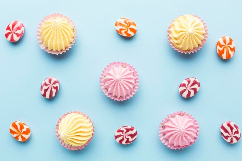 Сupcakes and Lollipops on a Blue Background